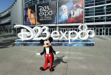 Mickey Mouse standing in front of the convention center.